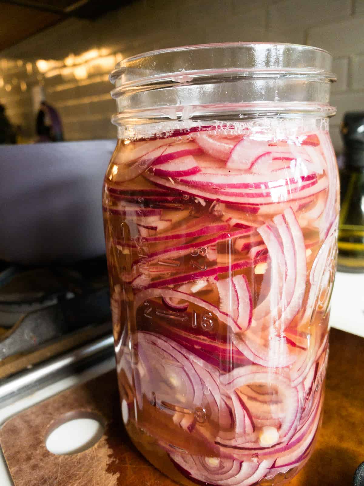 pickled red onions in a mason jar cooling for storage in the fridge