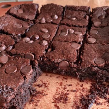 gluten free fudgy vegan brownies on parchment paper