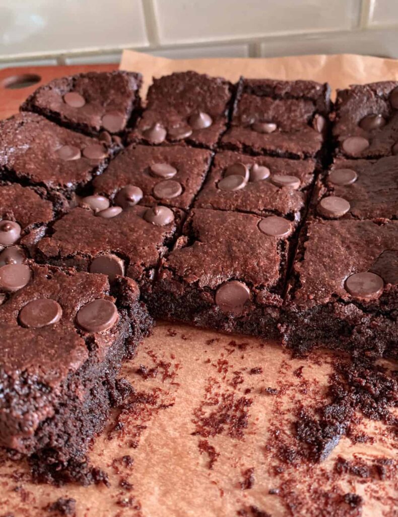 gluten free fudgy vegan brownies on parchment paper