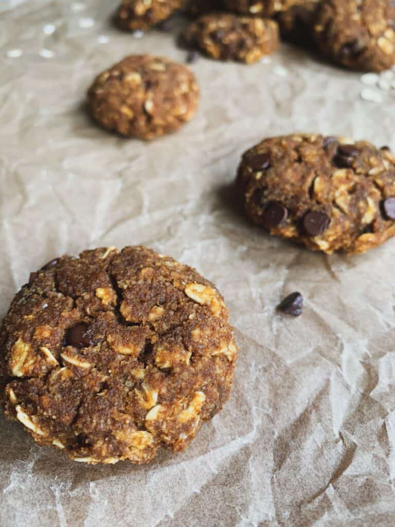 pumpkin spice oatmeal cookies on parchment