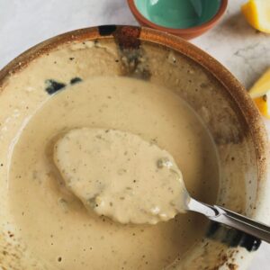 VEGAN oil free casesar dressing in a bowl with a spoon