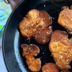 pan fried lion's mane mushrooms on a cast iron skillet