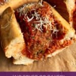 pinterest image of vegan meatball sub sliced in half ready to eat.