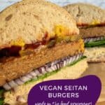 Pinterest image of vegan seitan burgers, prepared on a bun with lettuce, onion and pickles.