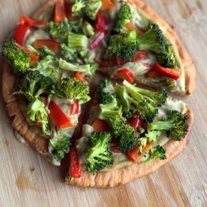 Lentil & cauliflower pizza sliced and ready to eat.