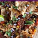 Pin for Dump & go taco casserole in glass dish topped with cilantro and lime