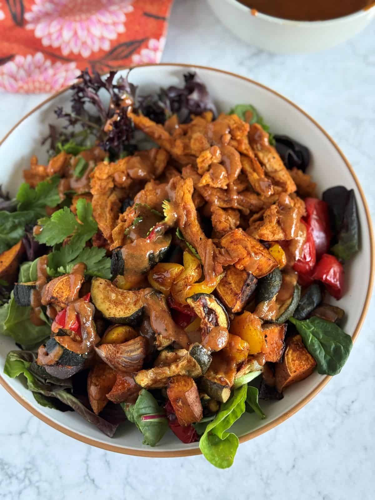 Sweet & smoky bbq soy curl bowl with oil free roasted vegetables and creamy bbq dressing.