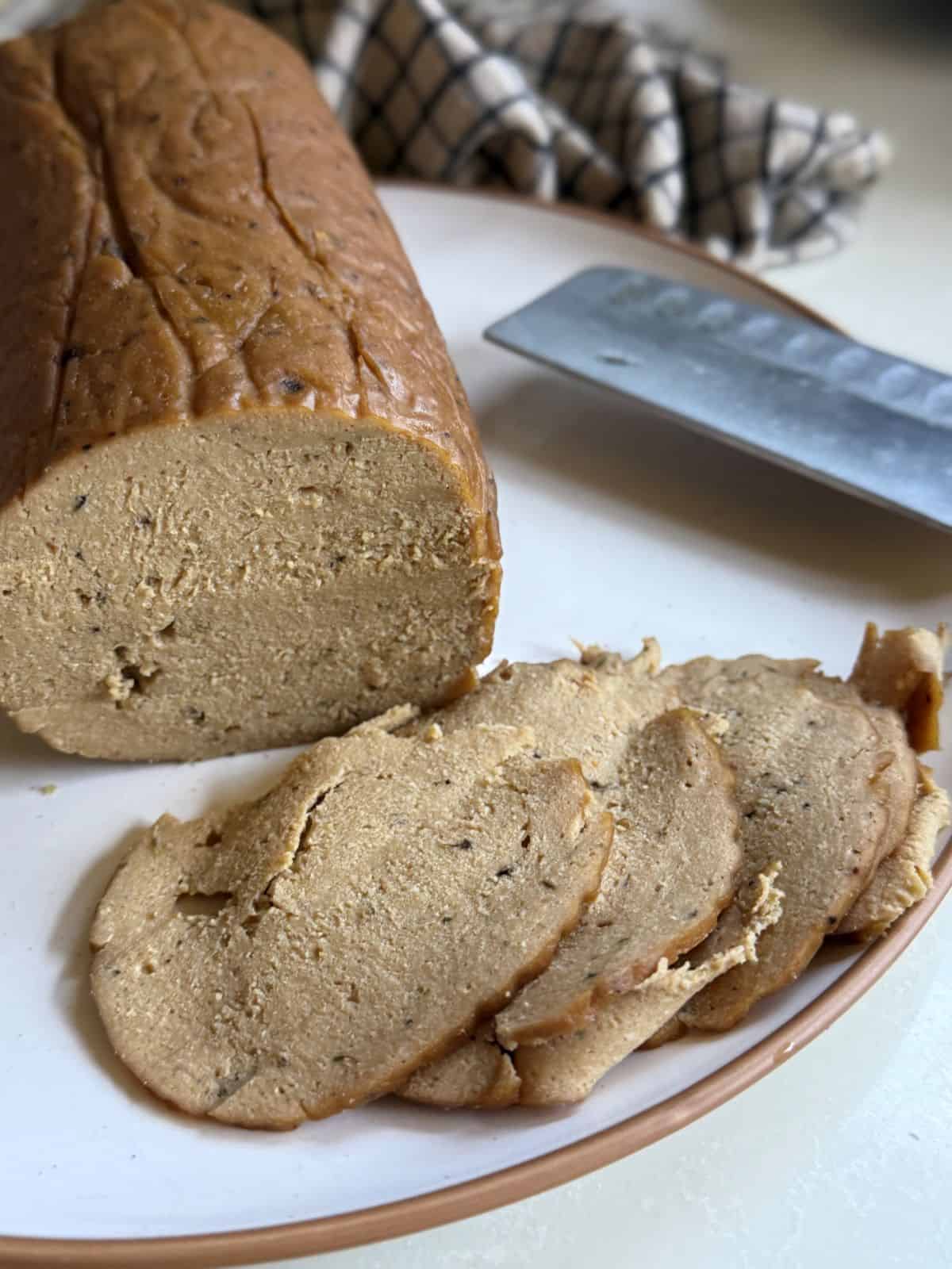 Vegan lunch meat slices on a plate.